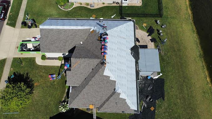 High-altitude drone inspection of a complex residential roof restoration project managed by a Peoria roofing company