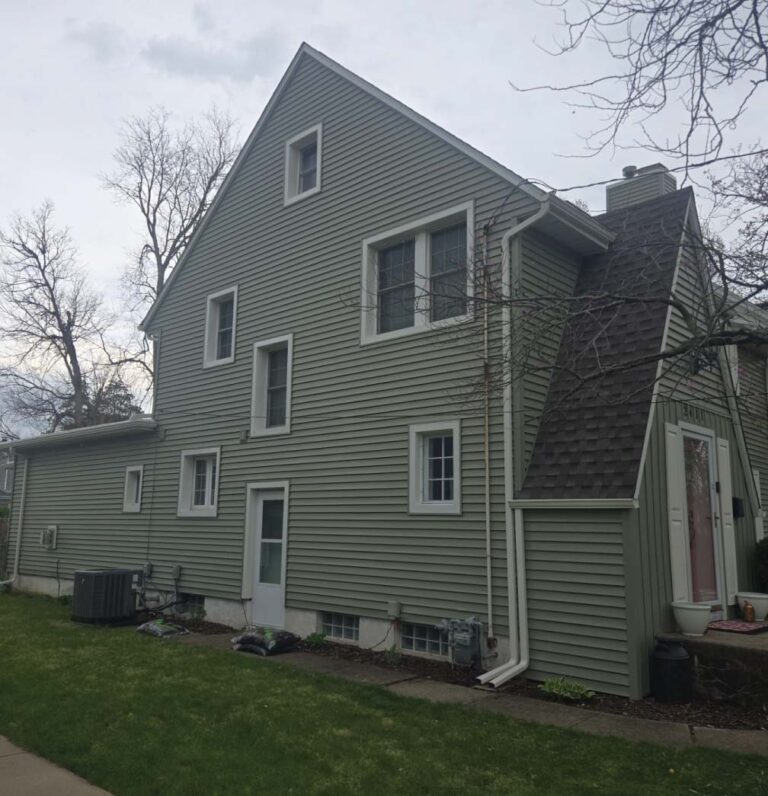 Miguel Rivera 13 Professional installation of durable vinyl siding on a residential property in Central Illinois.