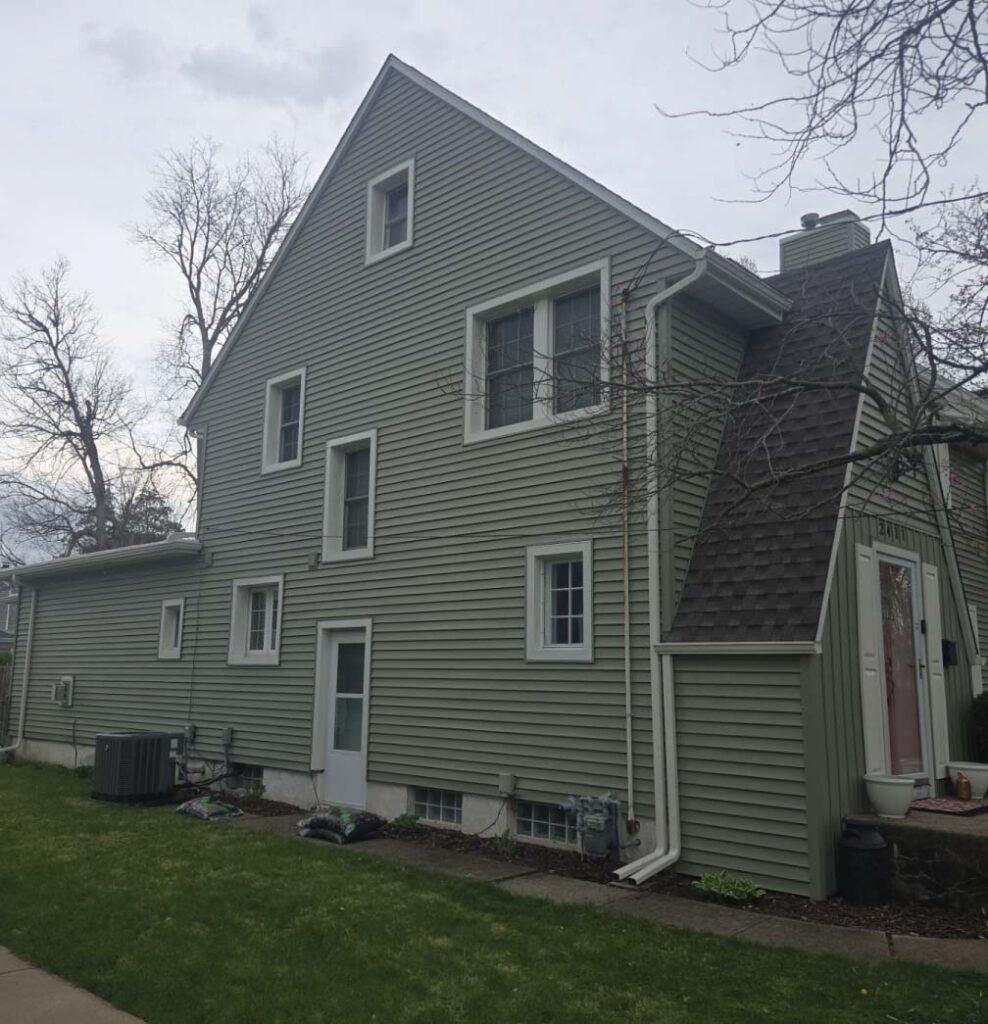 Professional installation of durable vinyl siding on a residential property in Central Illinois.