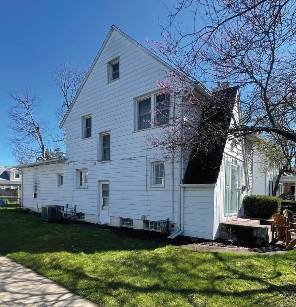 A beautifully restored Peoria home featuring a complete exterior overhaul including new roofing and gutter systems.